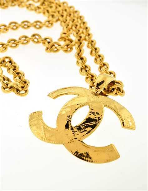 gold chanel logo pendant|Chanel necklace price list.